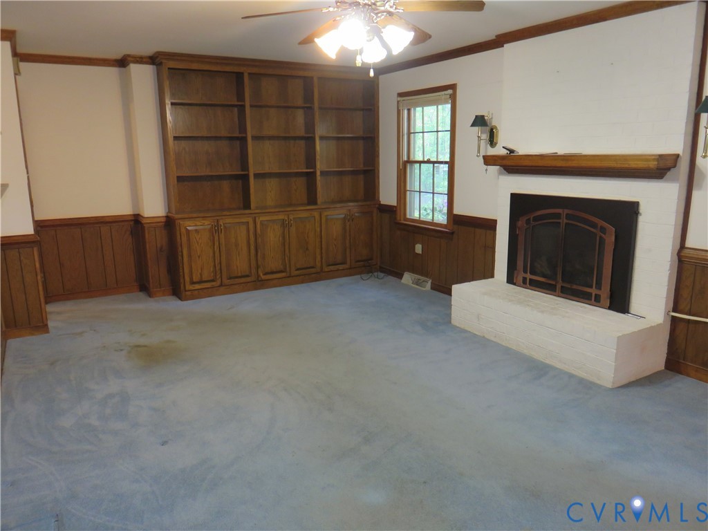 8379 Quailfield Road Mechanicsville, VA 23116 - Photo 27 of 56 an empty room with windows and fireplace