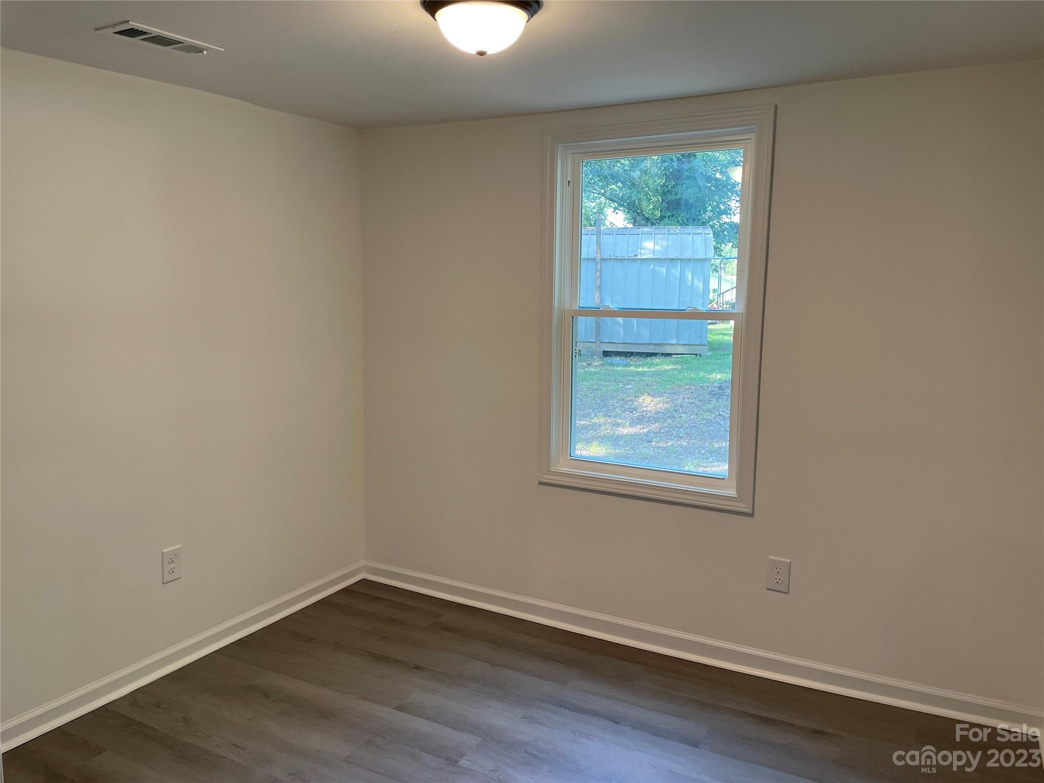205 Jerome Street Wingate, NC 28174 - Photo 5 of 7 an empty room with a window
