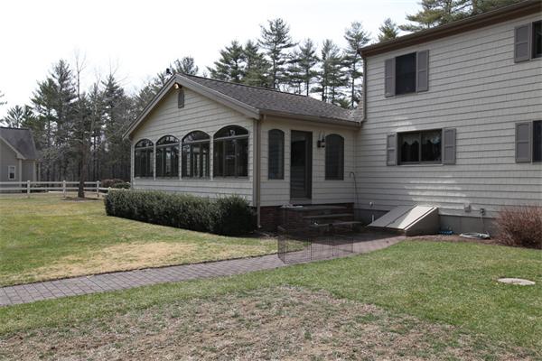 72 Sarah Sherman Road Rochester, MA 02770 - Photo 12 of 17 a front view of a house with garden