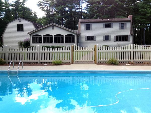 72 Sarah Sherman Road Rochester, MA 02770 - Photo 14 of 17 a view of a white house with a large window and wooden fence