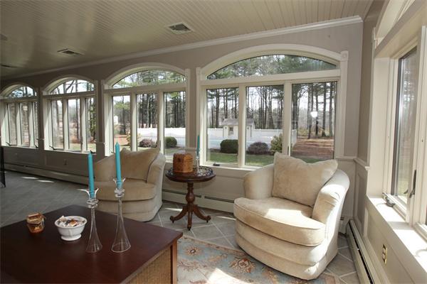 72 Sarah Sherman Road Rochester, MA 02770 - Photo 5 of 17 a living room with furniture and a floor to ceiling window