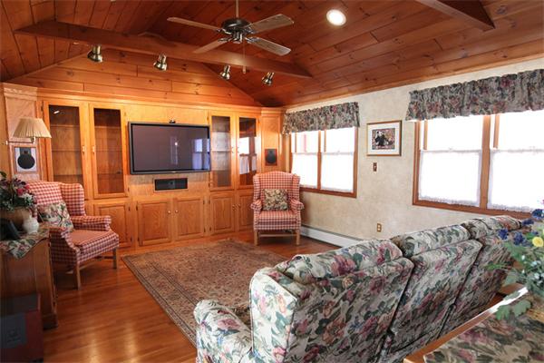 72 Sarah Sherman Road Rochester, MA 02770 - Photo 8 of 17 a living room with furniture and a flat screen tv