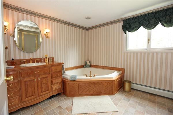 72 Sarah Sherman Road Rochester, MA 02770 - Photo 9 of 17 a bathroom with a tub a sink and a mirror
