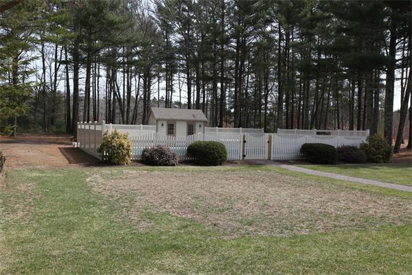 72 Sarah Sherman Road Rochester, MA 02770 - Photo 10 of 17 a front view of a house with a yard and trees