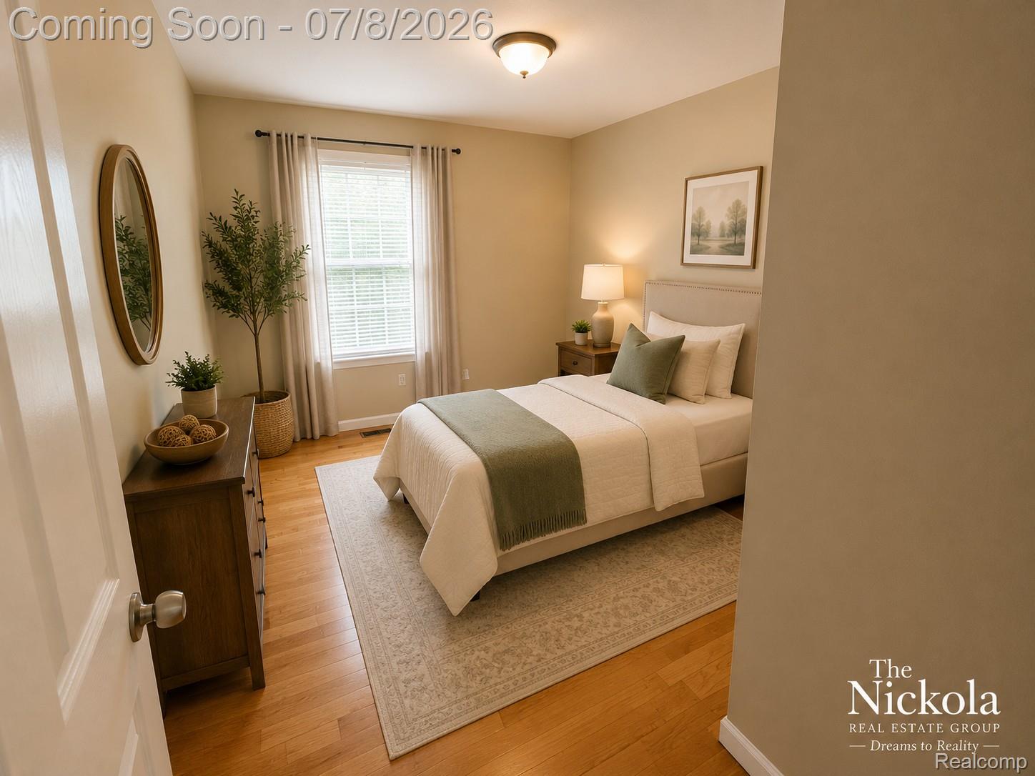 414 Whitney Drive Rochester, MI 48307 - Photo 23 of 30 Well-lit room featuring wood-finish flooring, neutral wall tones, a double window, and a flush-mount ceiling light