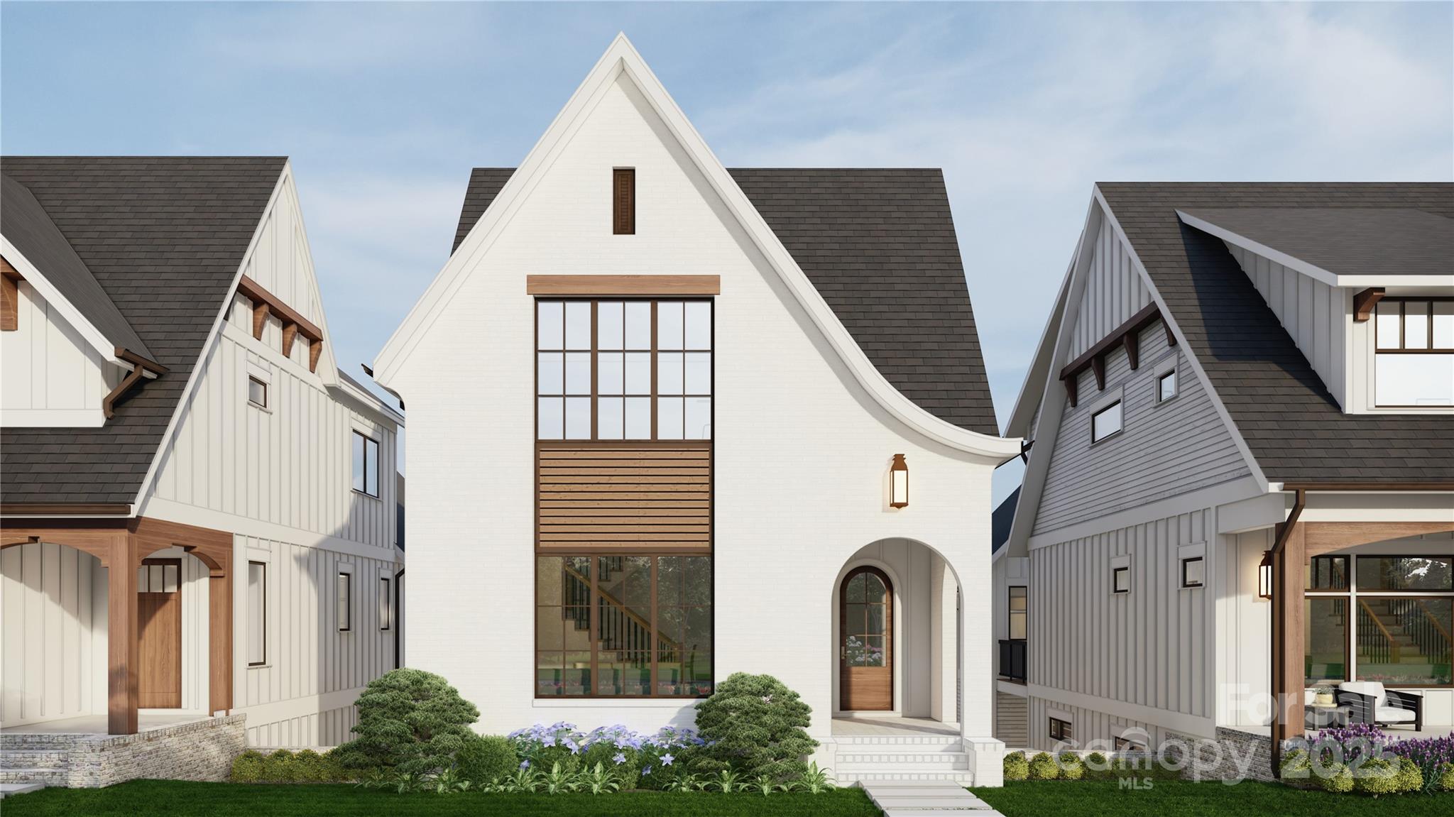 a view of a white house next to a yard