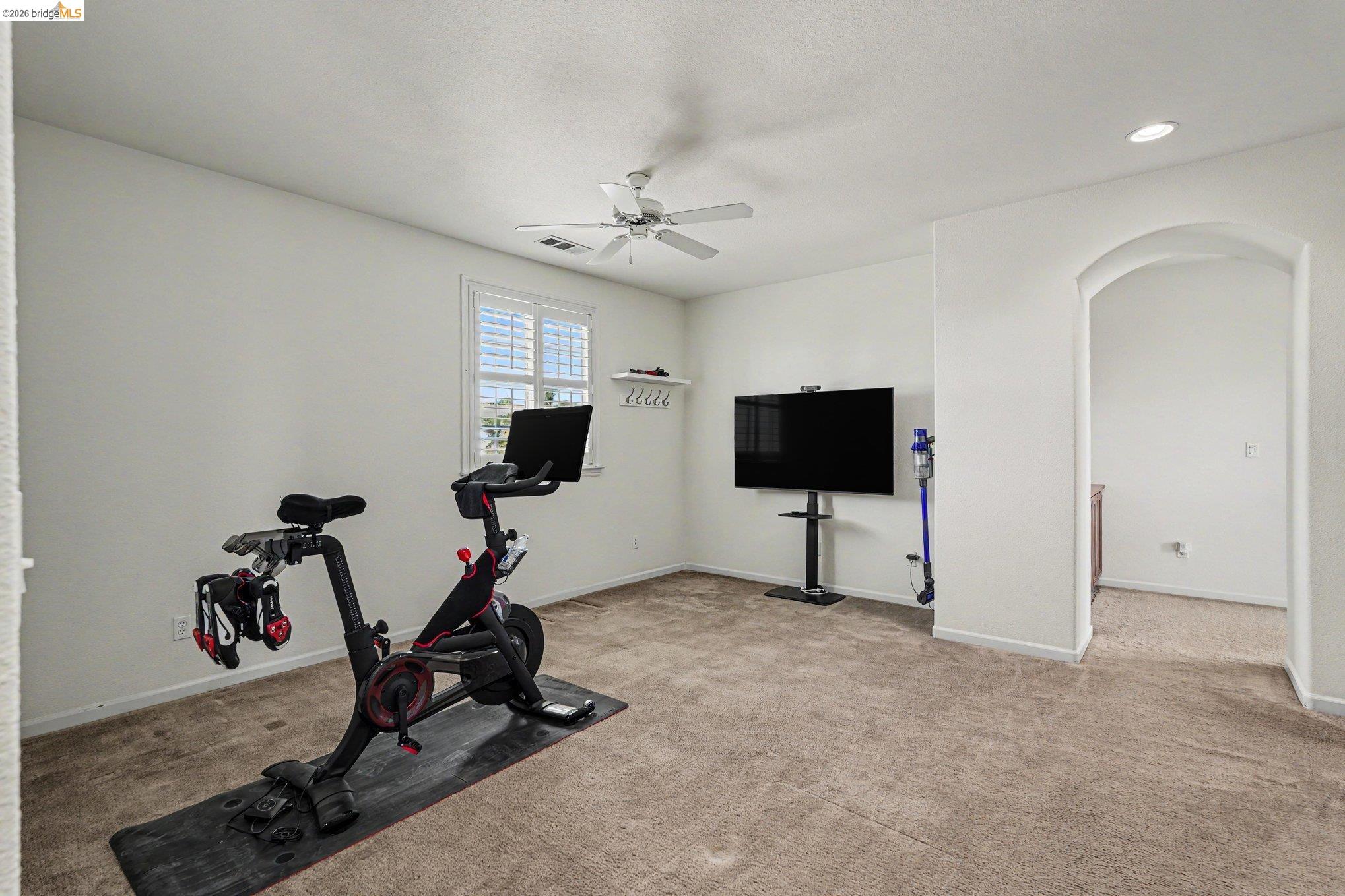 106 Little Ranch Circle Oakley, CA 94561 - Photo 16 of 34 Carpeted room featuring a ceiling fan with light, recessed lighting, and an arched doorway