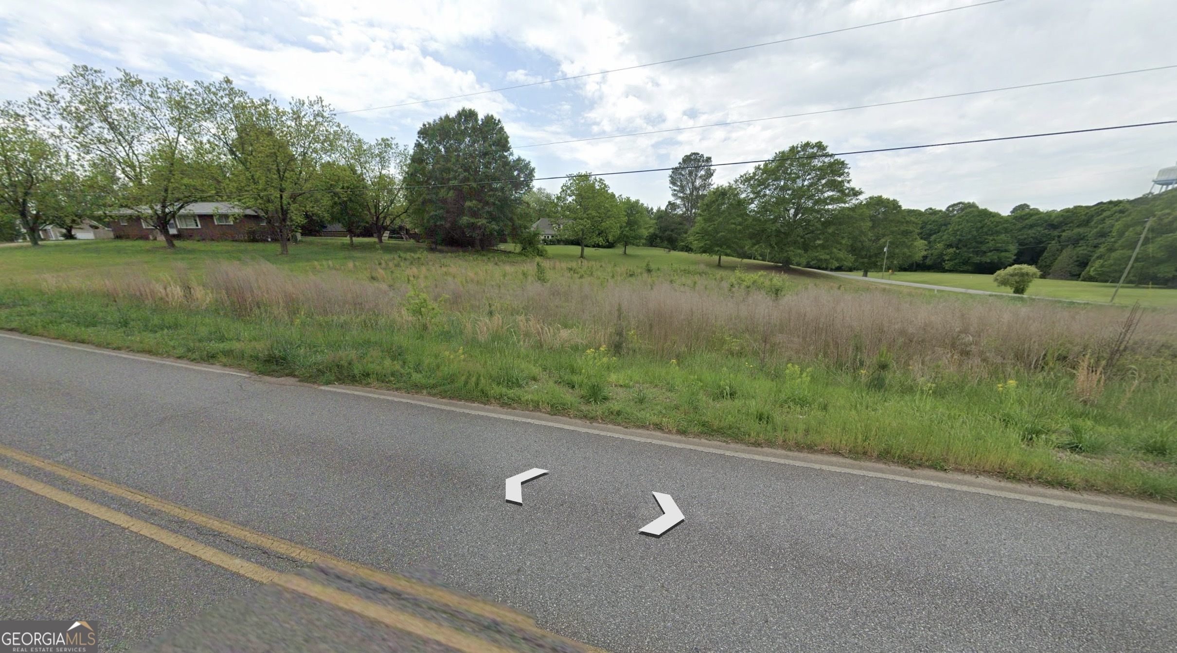 0 Smith Street Royston, GA 30662 - Photo 4 of 8 a view of a green field with wooden fence