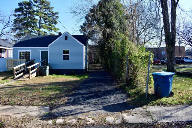 a view of a house with a yard and wooden floor
