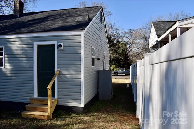 a brick building with a small yard in front of it