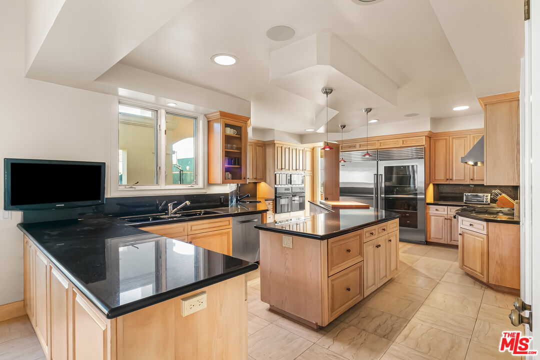 0 Broad Beach Road Malibu, CA 90265 - Photo 19 of 54 a kitchen with stainless steel appliances granite countertop a stove and a sink