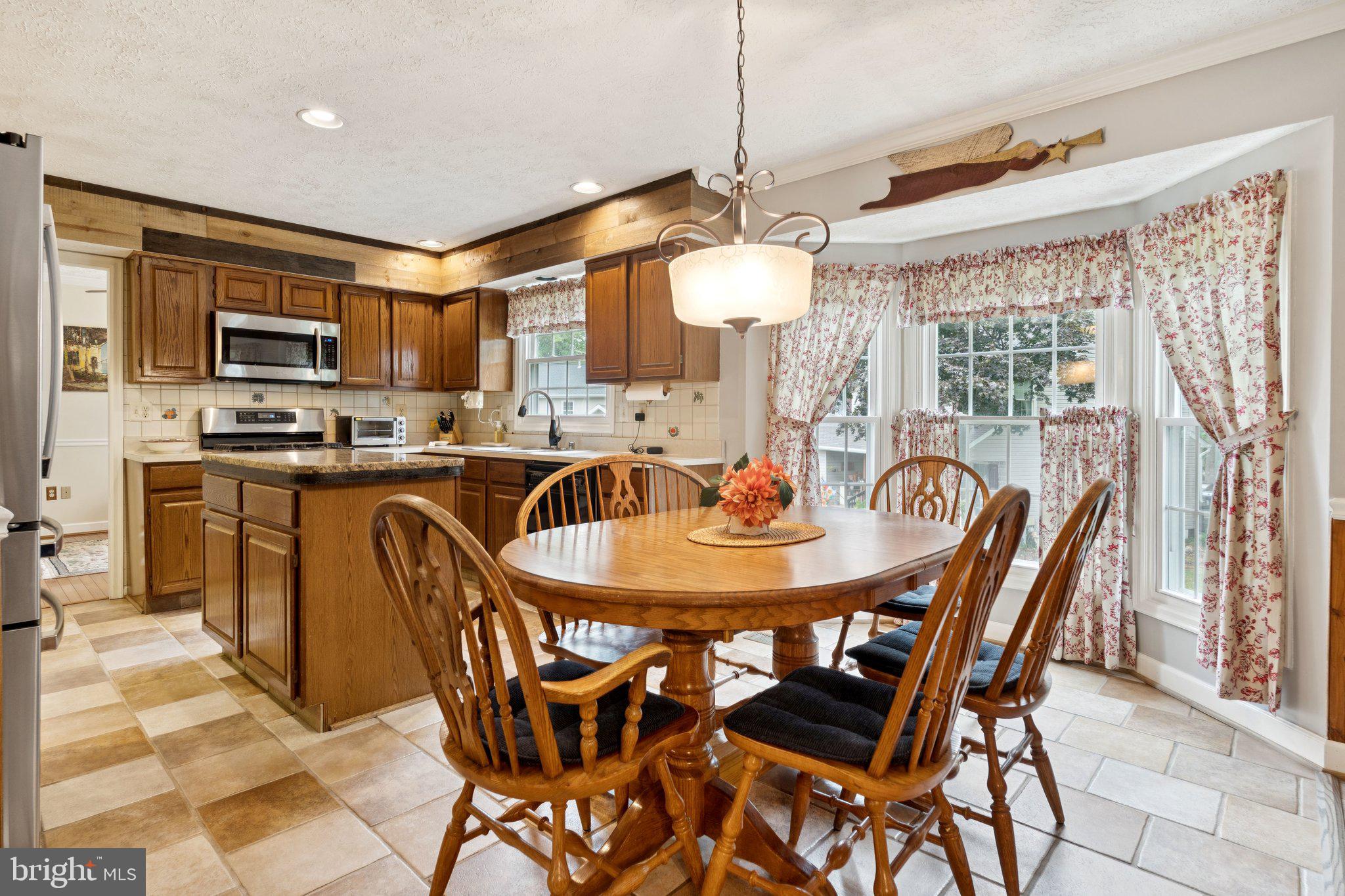 817 Peppard Drive Bel Air, MD 21014 - Photo 14 of 49 a view of a dining room with furniture window and outside view