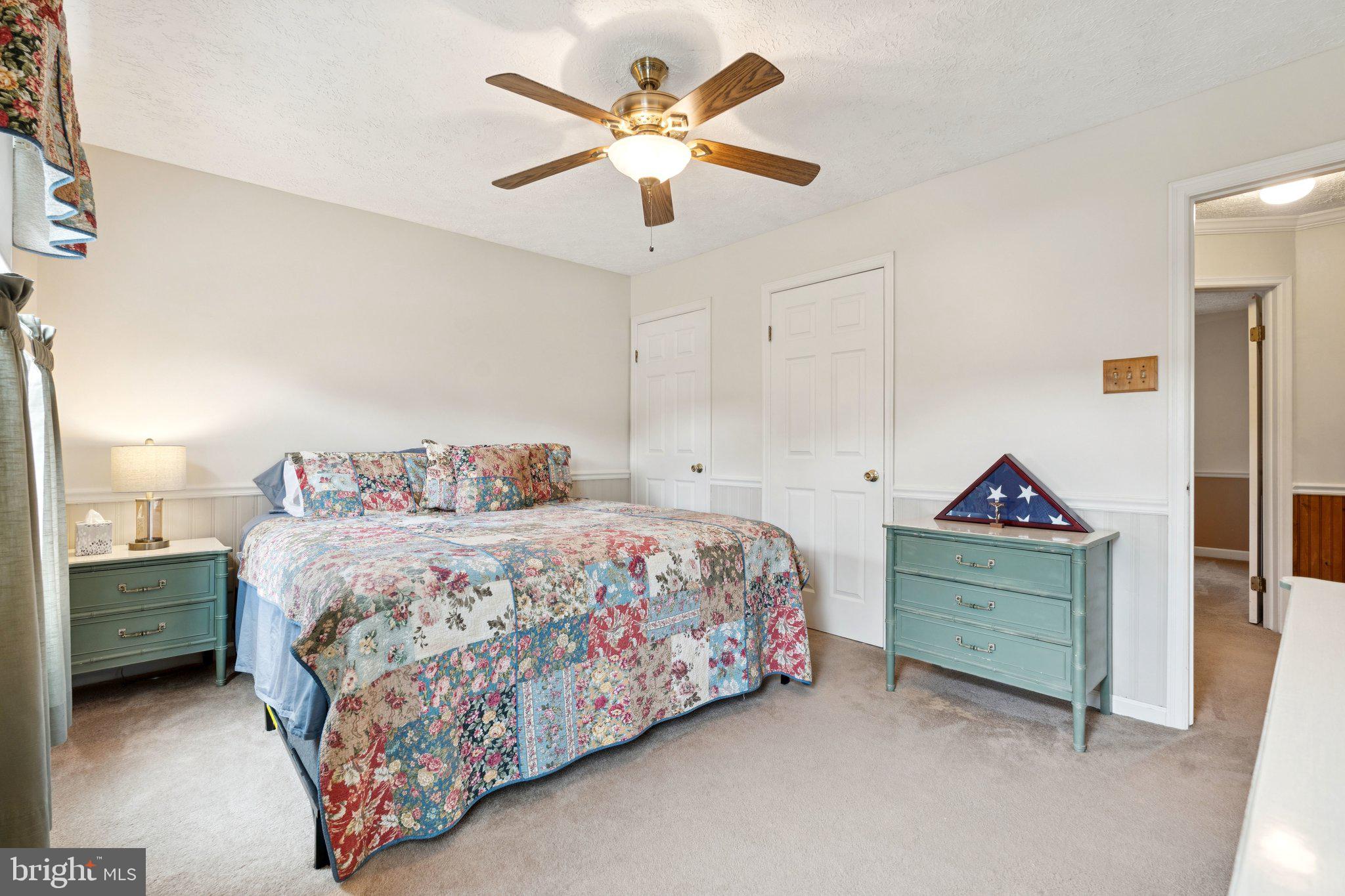 817 Peppard Drive Bel Air, MD 21014 - Photo 23 of 49 a bedroom with a bed and a chandelier