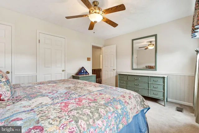 a bedroom with a bed and a dresser