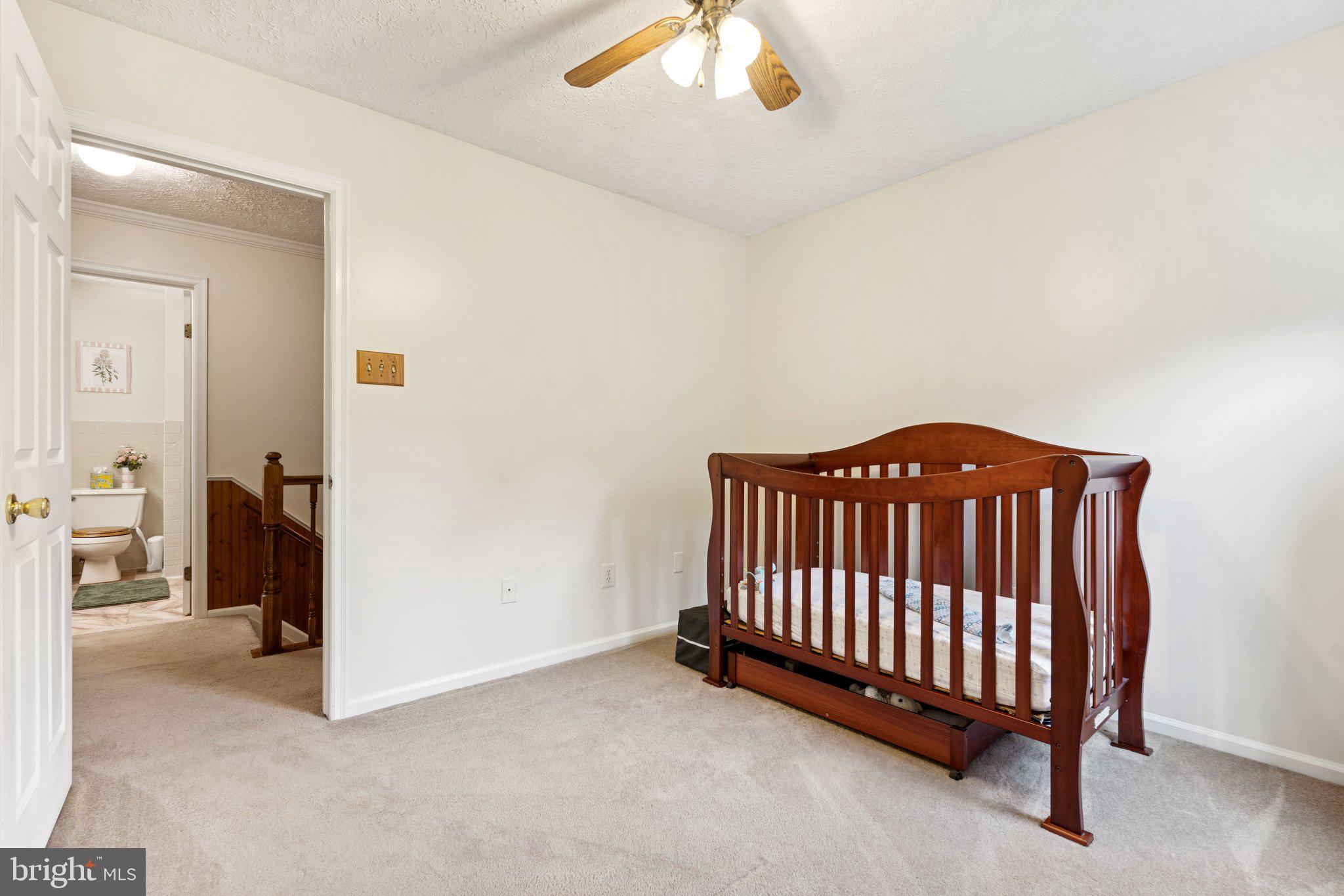 817 Peppard Drive Bel Air, MD 21014 - Photo 30 of 49 a view of a bedroom with furniture and a chandelier fan