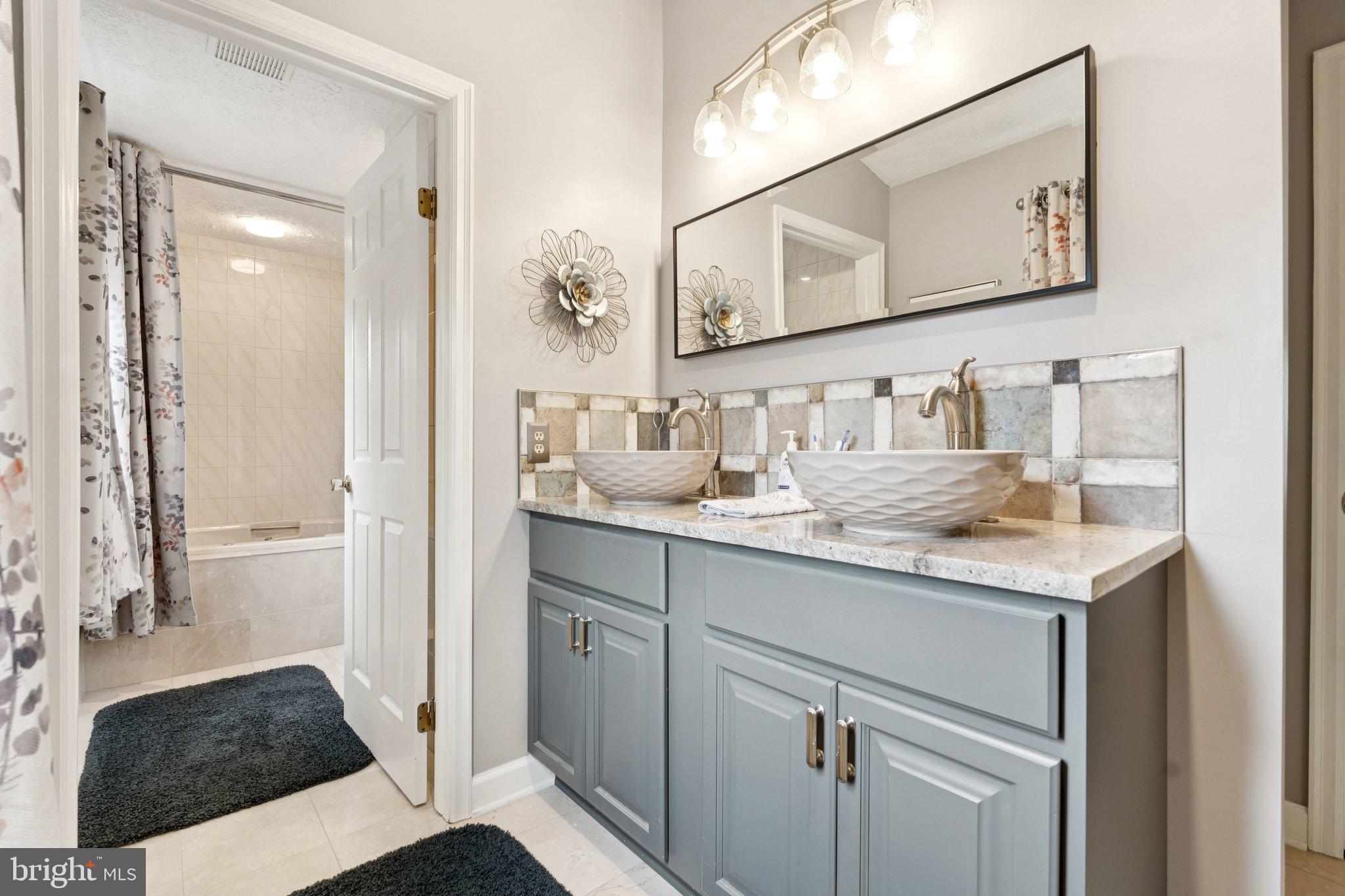 817 Peppard Drive Bel Air, MD 21014 - Photo 36 of 49 a bathroom with a sink and a mirror