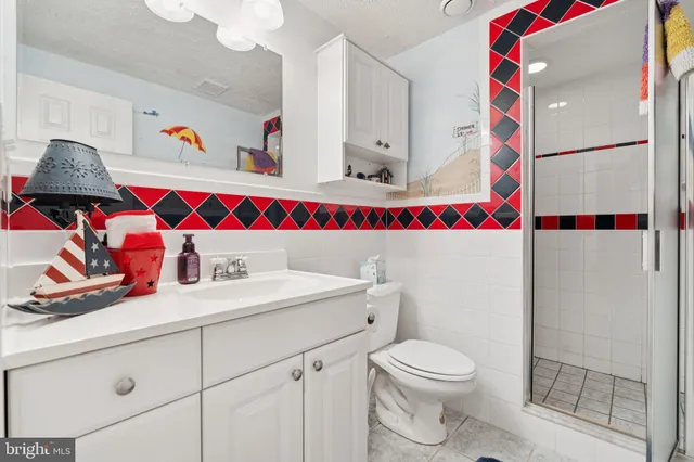 a living room with furniture a window and a chandelier