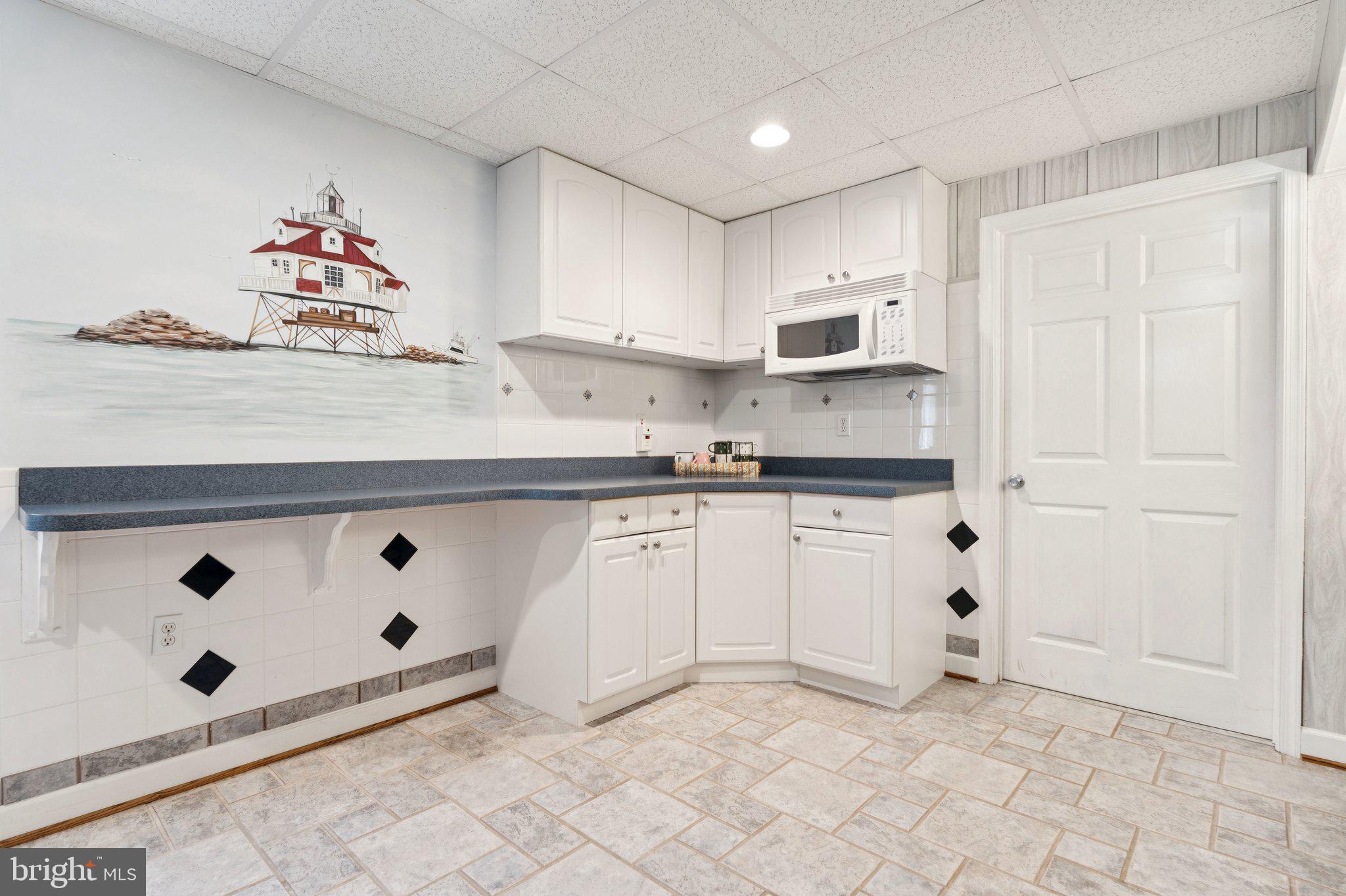 817 Peppard Drive Bel Air, MD 21014 - Photo 43 of 49 a kitchen with granite countertop a sink cabinets and stainless steel appliances