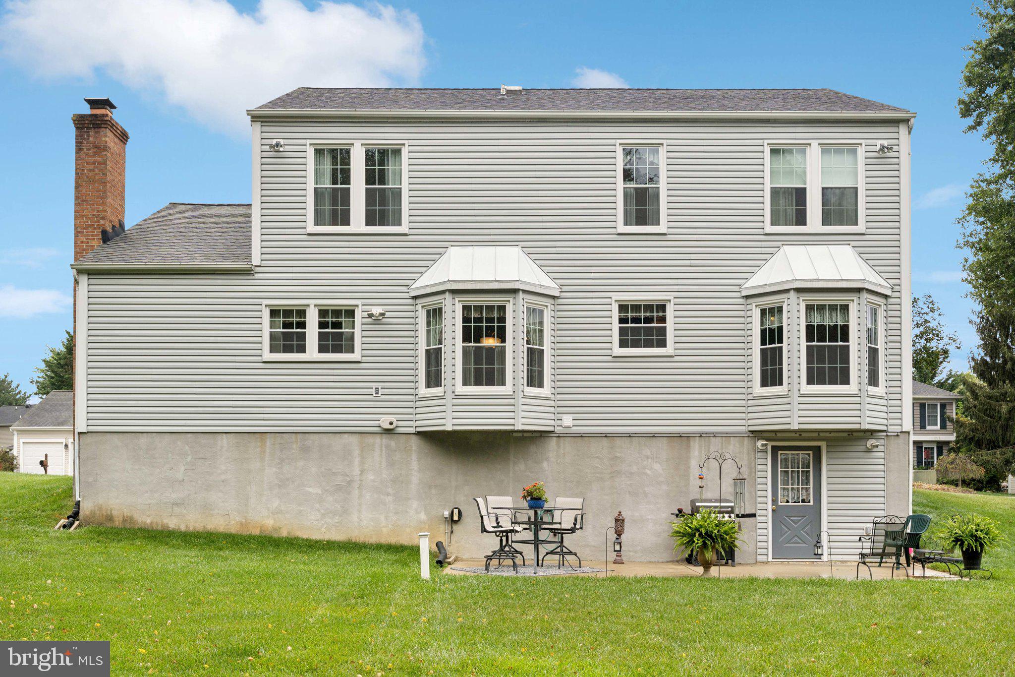 817 Peppard Drive Bel Air, MD 21014 - Photo 47 of 49 a front view of a house with a yard and potted plants