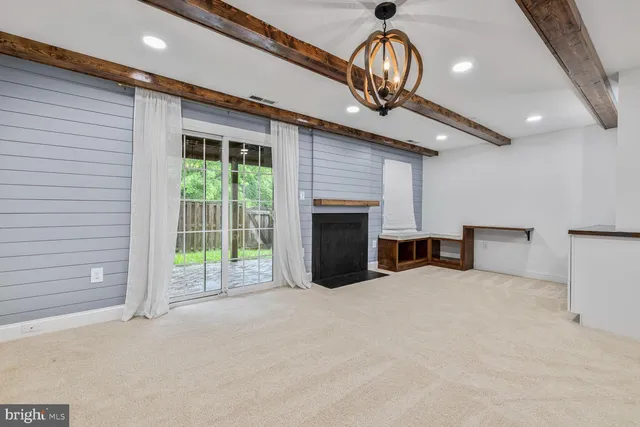 a view of an empty room with a fireplace