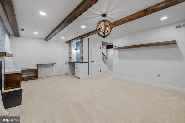 an empty room with wooden floor