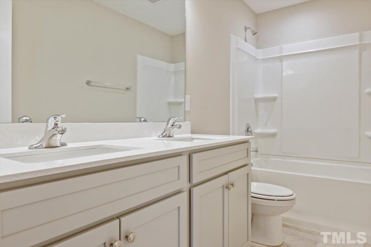2215 Campbell Loop, Unit 49 Burlington, NC 27215 - Photo 25 of 48 a bathroom with a sink a toilet and shower