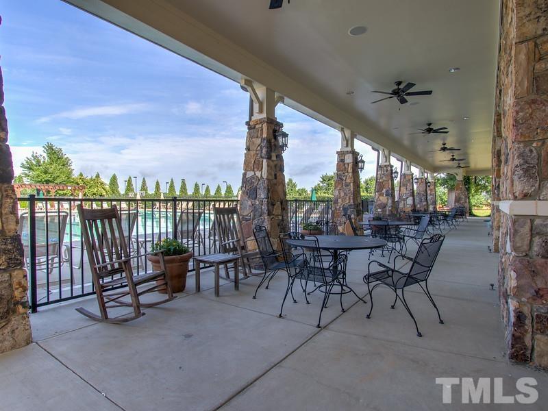 2215 Campbell Loop, Unit 49 Burlington, NC 27215 - Photo 33 of 48 a view of a patio with a table and chairs
