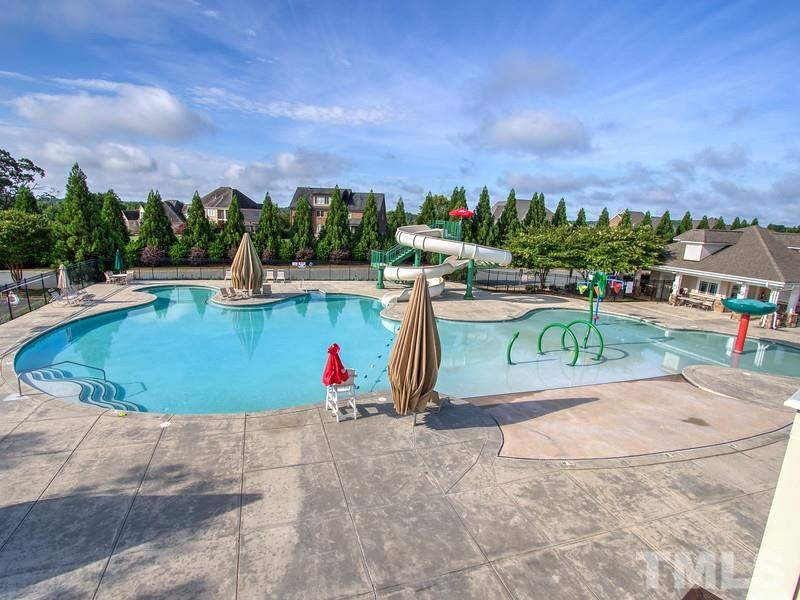 2215 Campbell Loop, Unit 49 Burlington, NC 27215 - Photo 35 of 48 a view of a swimming pool with a lounge chairs