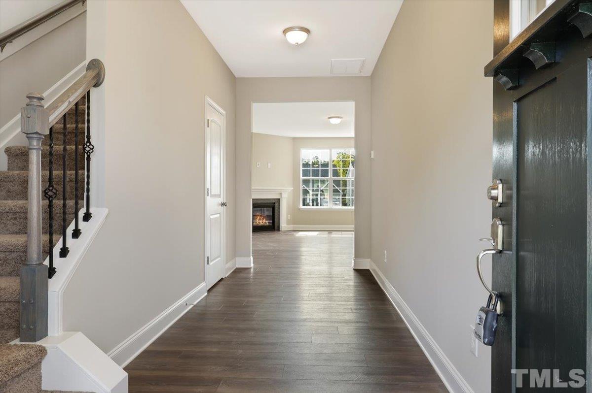2215 Campbell Loop, Unit 49 Burlington, NC 27215 - Photo 6 of 48 a view of a hallway with wooden floor and stairs