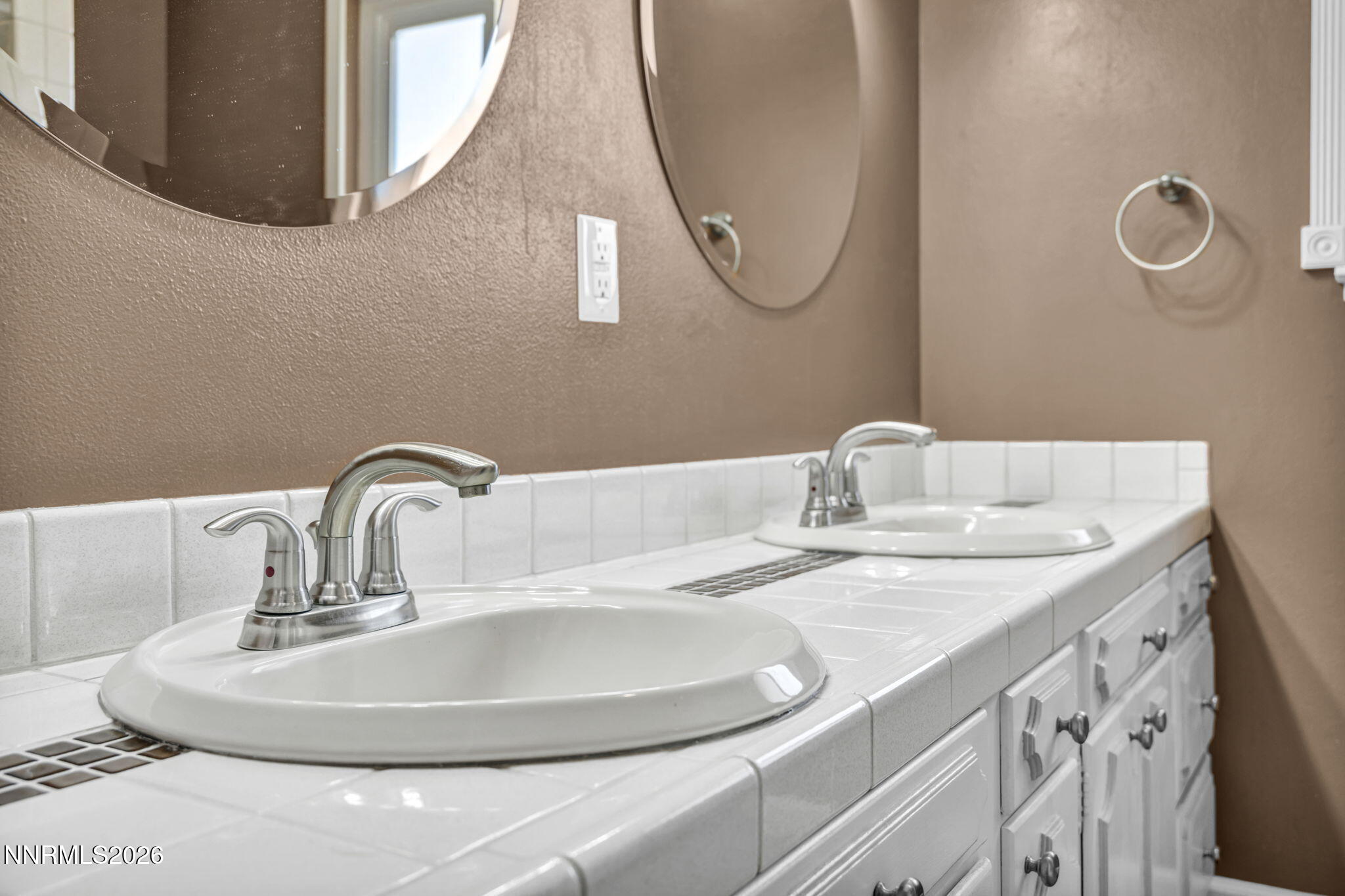 14190 Rim Rock Drive Reno, NV 89521 - Photo 43 of 68 a bathroom with a sink and a mirror