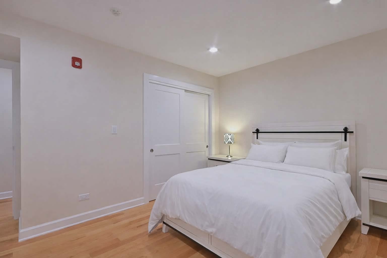 3045 North Paris Avenue, Unit 203 River Grove, IL 60171 - Photo 14 of 27 a bedroom with a bed and a night stand