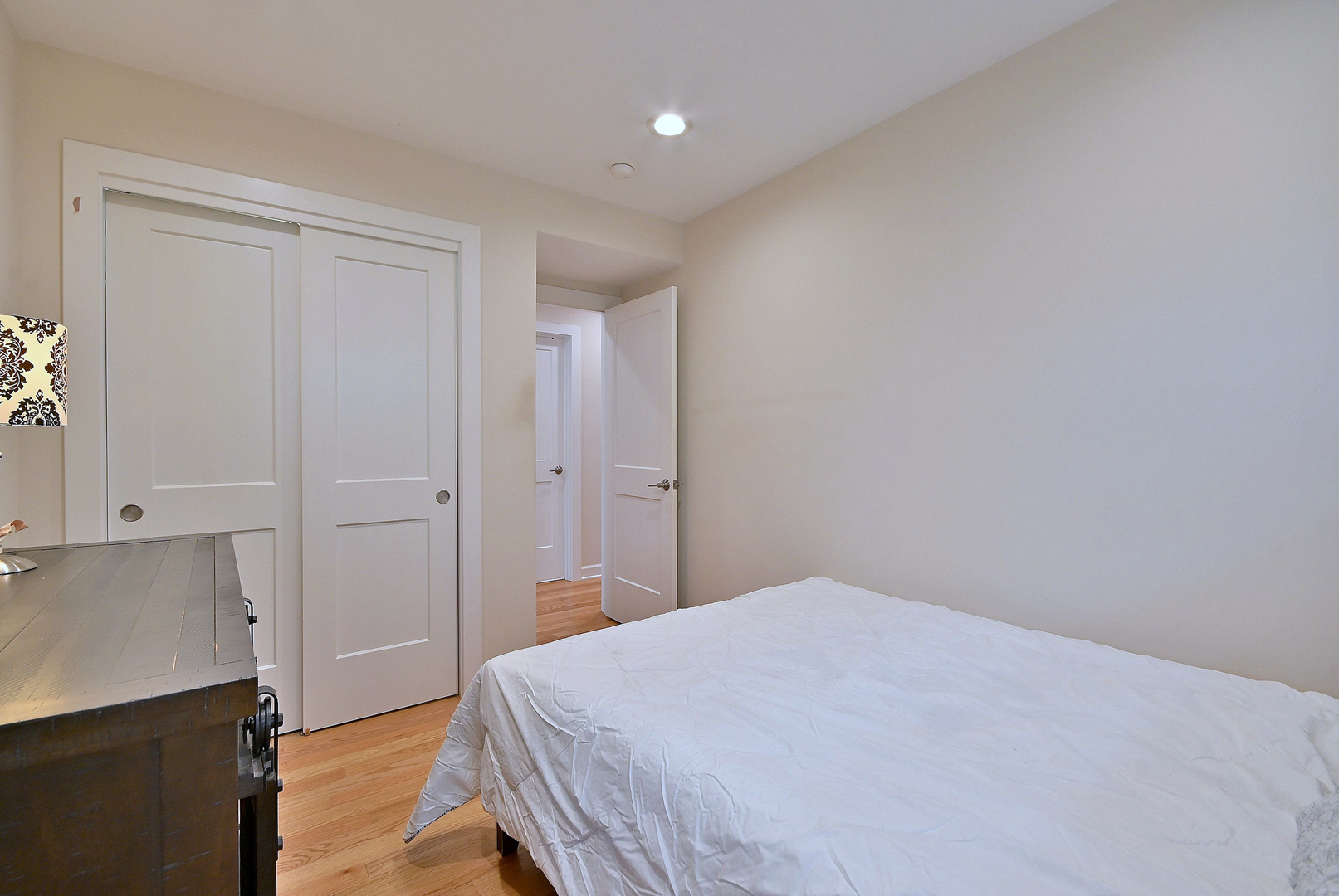 3045 North Paris Avenue, Unit 203 River Grove, IL 60171 - Photo 16 of 27 a bedroom with a bed and hallway