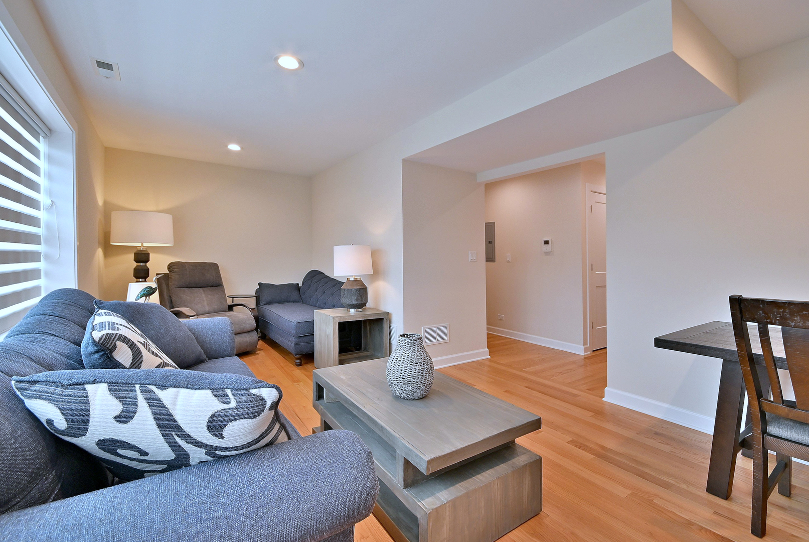 3045 North Paris Avenue, Unit 203 River Grove, IL 60171 - Photo 4 of 27 a living room with furniture and a wooden floor