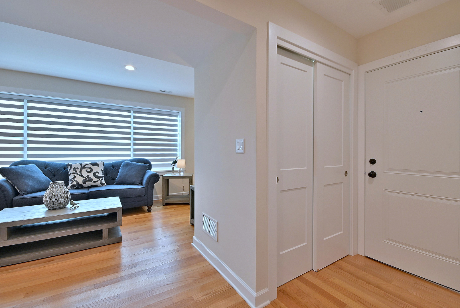 3045 North Paris Avenue, Unit 203 River Grove, IL 60171 - Photo 7 of 27 a living room with furniture and a wooden floor