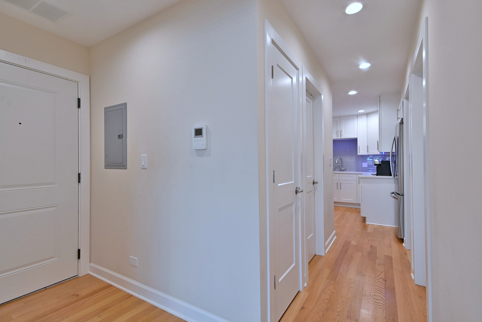 3045 North Paris Avenue, Unit 203 River Grove, IL 60171 - Photo 8 of 27 a view of a hallway with wooden floor