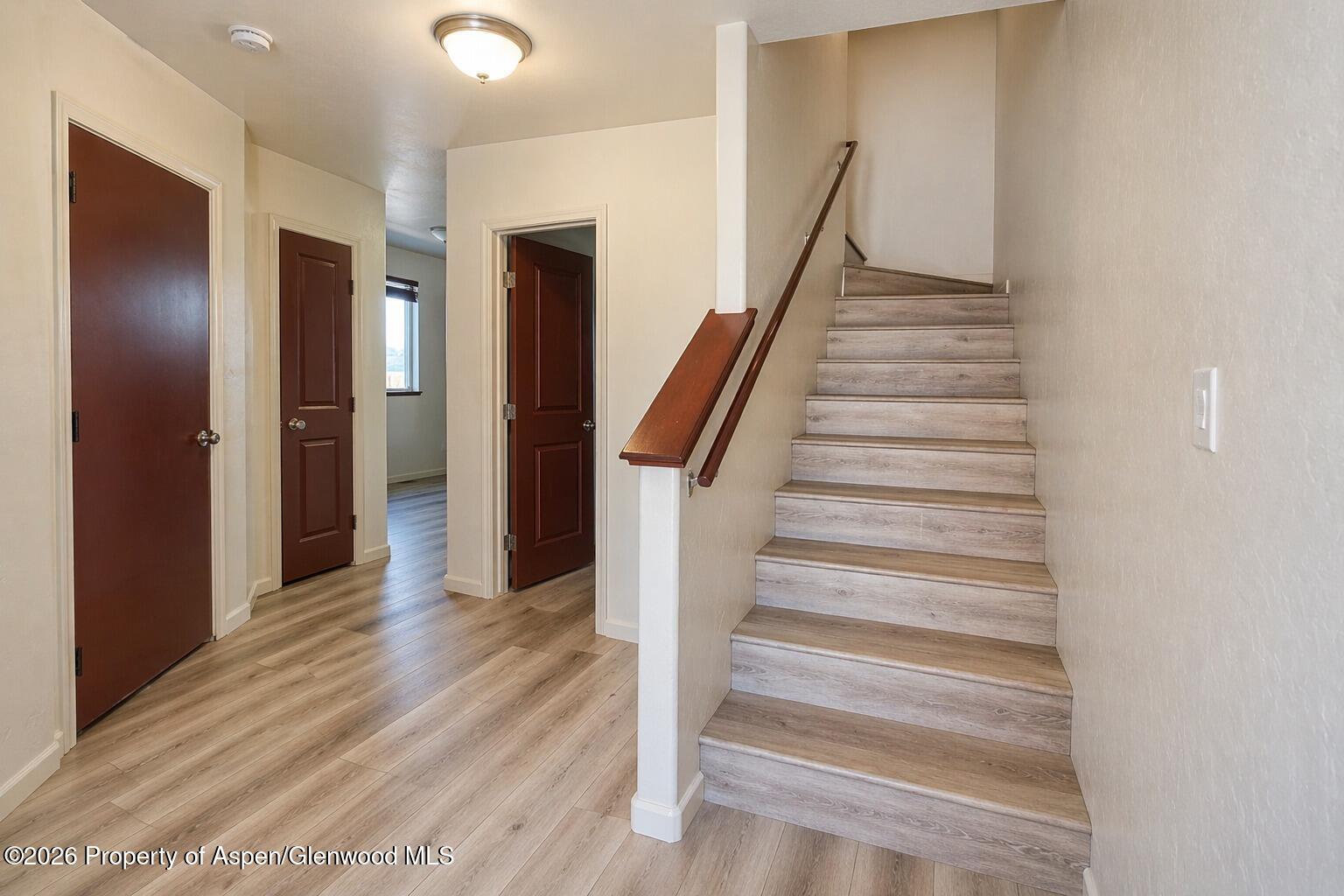 1648 Arabian Avenue Rifle, CO 81650 - Photo 7 of 15 a view of a hallway with wooden floor and entryway