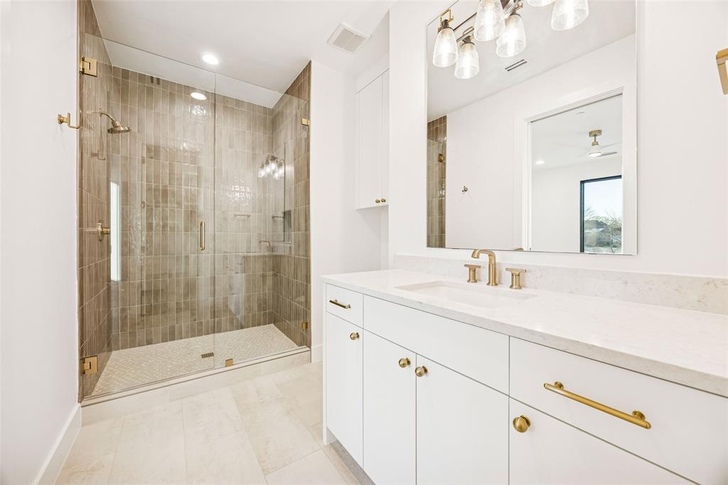 Tbd Tbd Fm1171 Roanoke, TX 76262 - Photo 26 of 36 a bathroom with a shower sink vanity and mirror