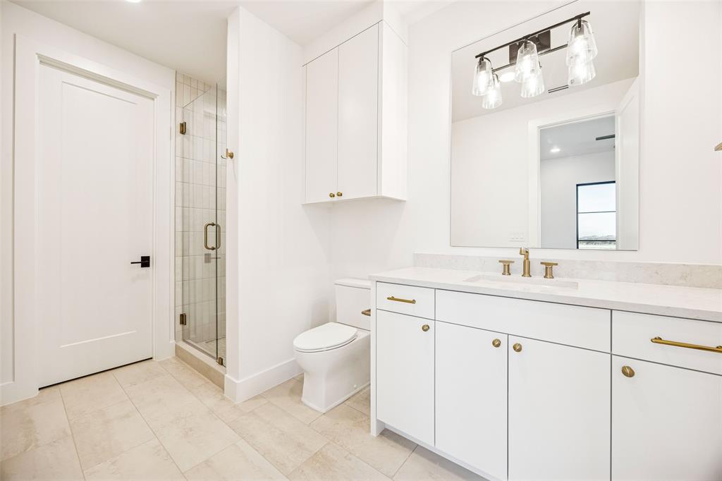 Tbd Tbd Fm1171 Roanoke, TX 76262 - Photo 28 of 36 a bathroom with a granite countertop sink a toilet and a mirror