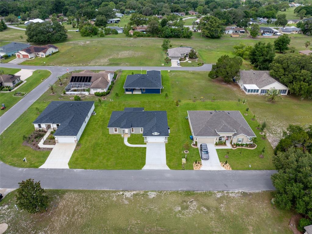 5441 Chestnut Ridge Road Dade City, FL 33523 - Photo 18 of 23 an aerial view of a house with yard swimming pool and outdoor seating