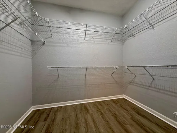 a view of a room with racks on the wall