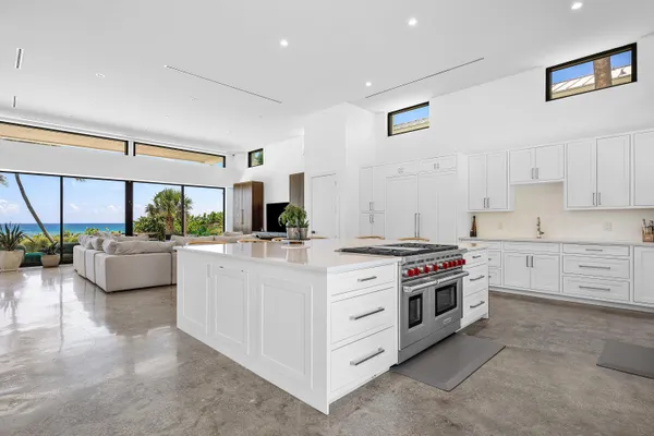 a kitchen with stainless steel appliances a stove a sink and a refrigerator