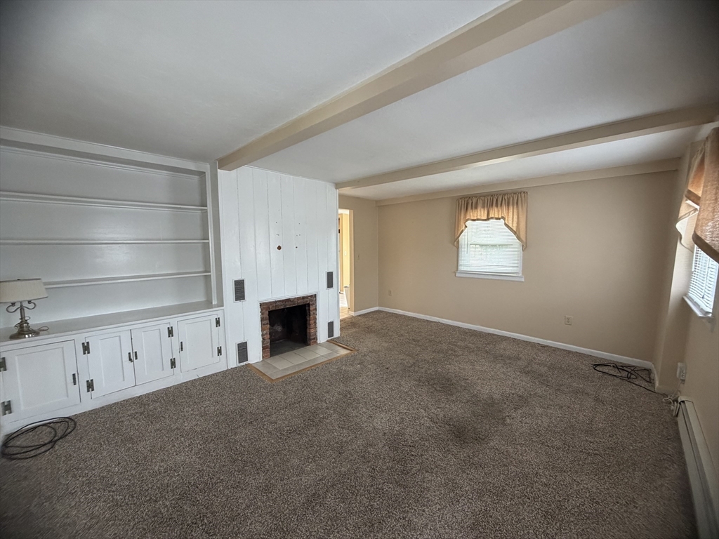 79 North Main Street, Unit A Bellingham, MA 02019 - Photo 14 of 22 a view of an empty room with a window