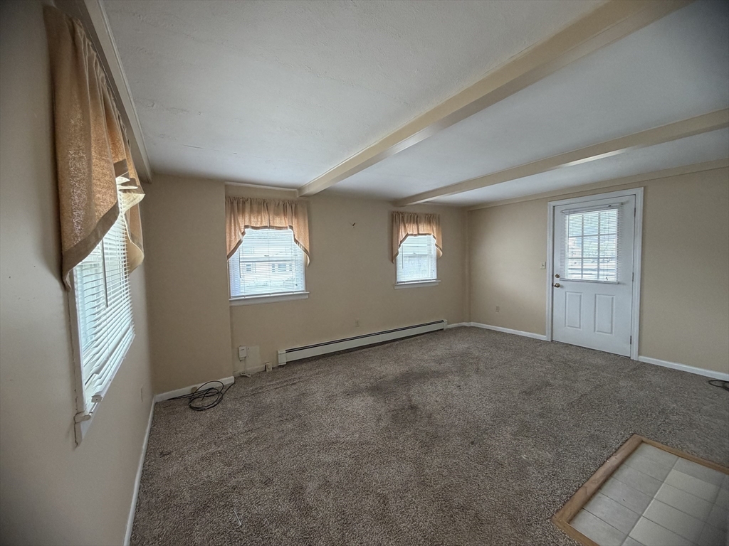 79 North Main Street, Unit A Bellingham, MA 02019 - Photo 18 of 22 a view of an empty room with windows