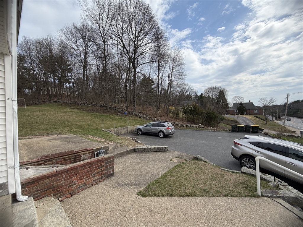 79 North Main Street, Unit A Bellingham, MA 02019 - Photo 20 of 22 a view of a backyard with table and chairs