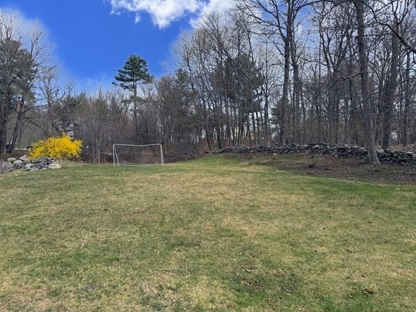79 North Main Street, Unit A Bellingham, MA 02019 - Photo 22 of 22 a backyard of a house with table and chairs