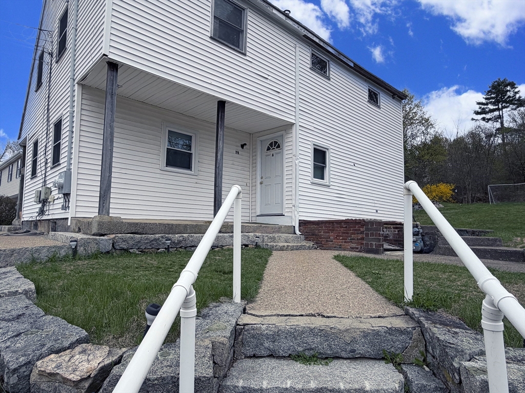 79 North Main Street, Unit A Bellingham, MA 02019 - Photo 3 of 22 a front view of a house with a yard