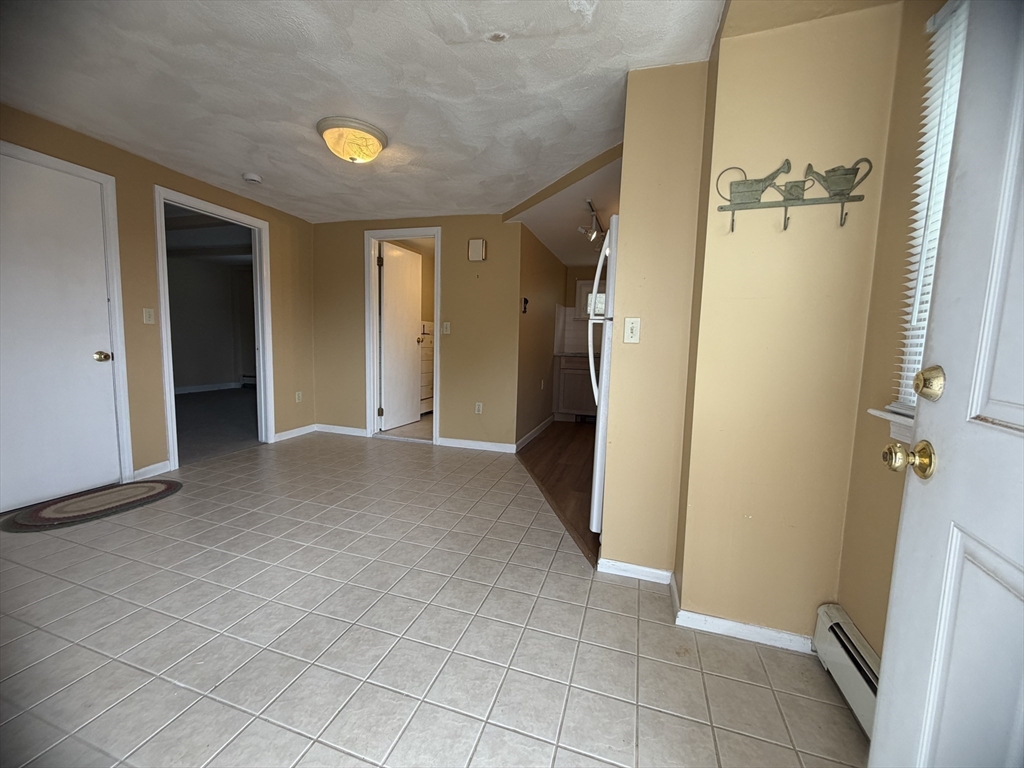 79 North Main Street, Unit A Bellingham, MA 02019 - Photo 5 of 22 a view of a hallway with a bathroom