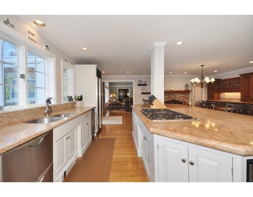 336 Lexington Road Concord, MA 01742 - Photo 11 of 29 a large kitchen with stainless steel appliances granite countertop a lot of counter space and a sink