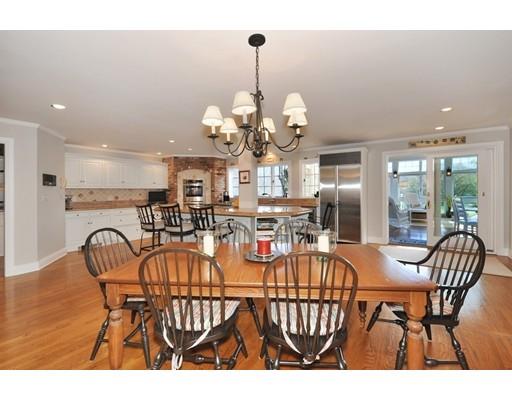 336 Lexington Road Concord, MA 01742 - Photo 12 of 29 a view of a dining room with furniture and chandelier