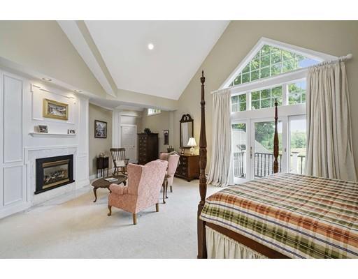 336 Lexington Road Concord, MA 01742 - Photo 14 of 29 a living room with furniture a fireplace and a large window